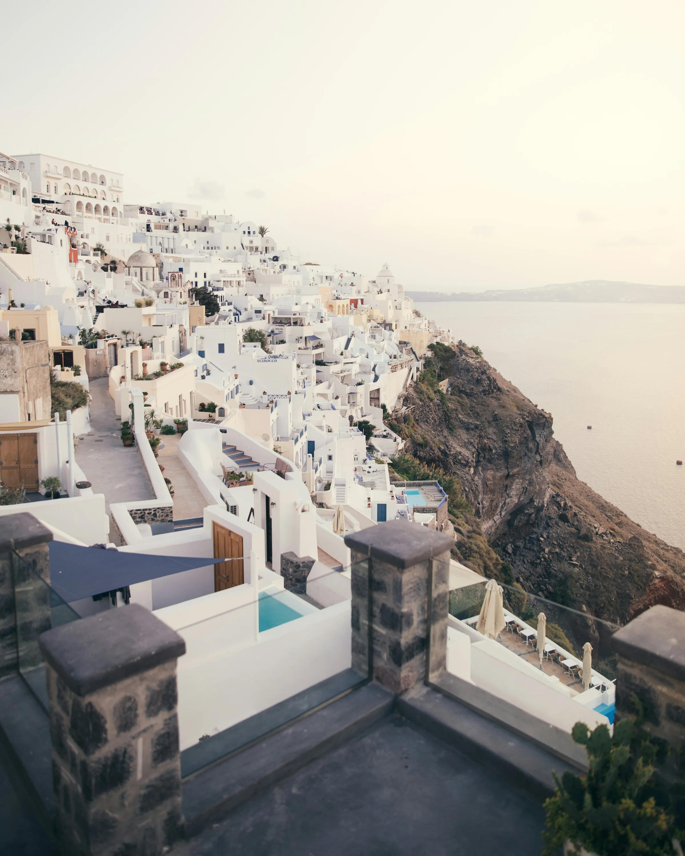 White hillside buildings overlooking the Aegean Sea in Santorini, Greece